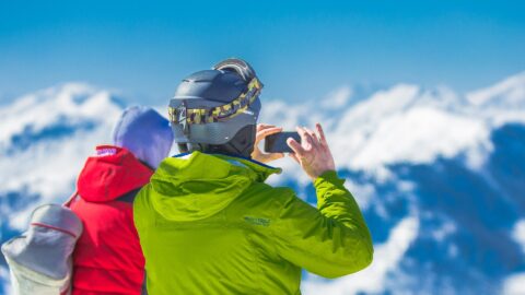 man skiing taking photo