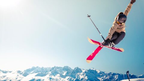 skiier jumping on mountain