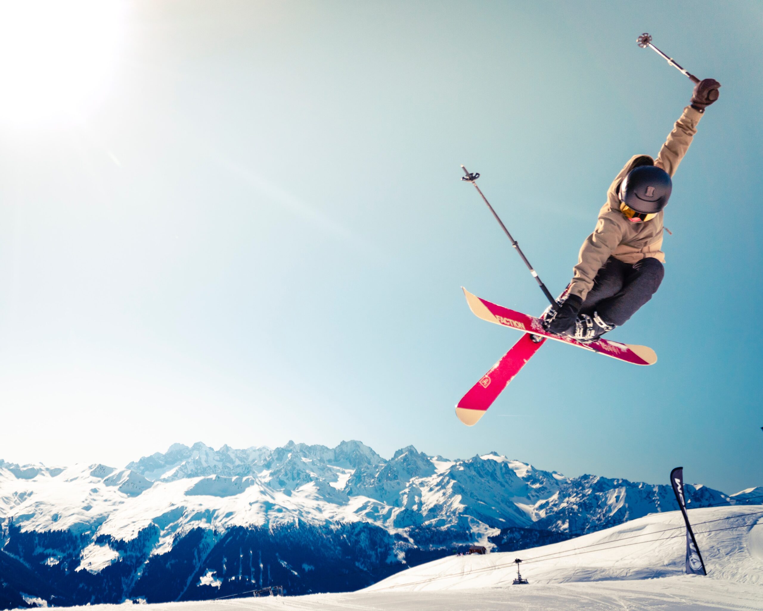 skiier jumping on mountain